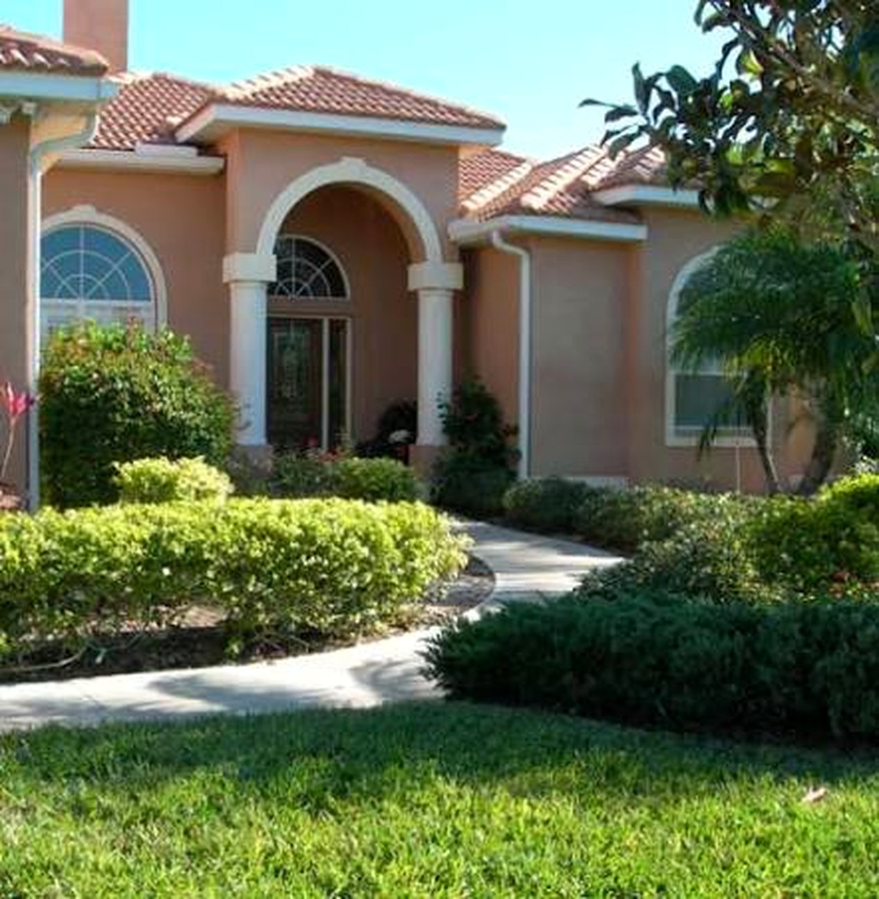 A manicured front lawn and walkway in Lithia