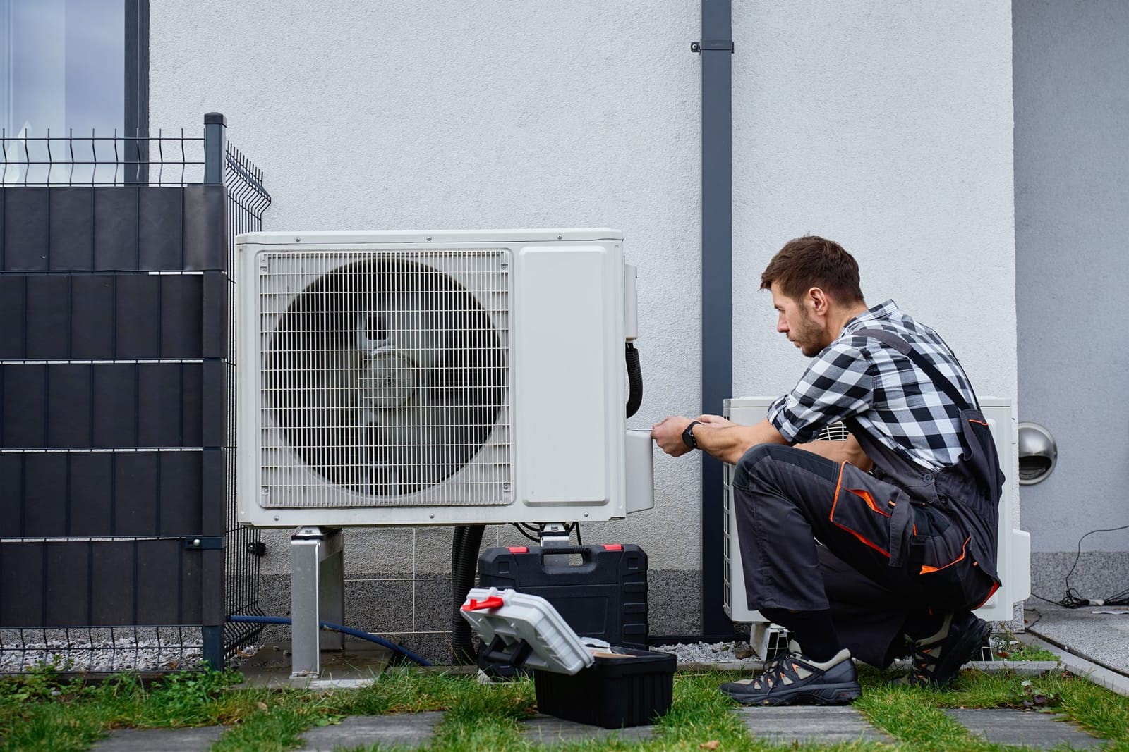 Proof photo of the serviced AC condenser on the tech's phone