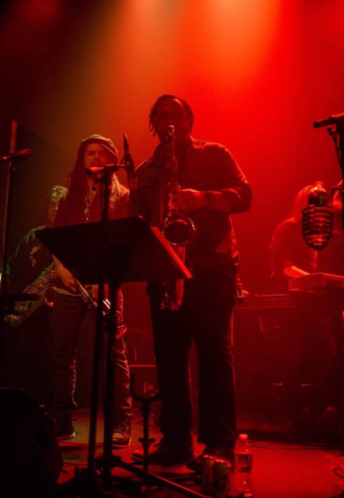 Marcelles Walker Quartet performing live under red stage lights
