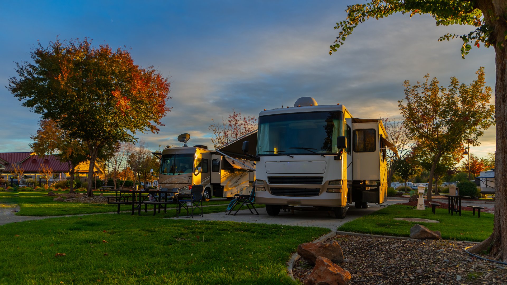 Open grassy sites with room for large motorhomes under a bright sky