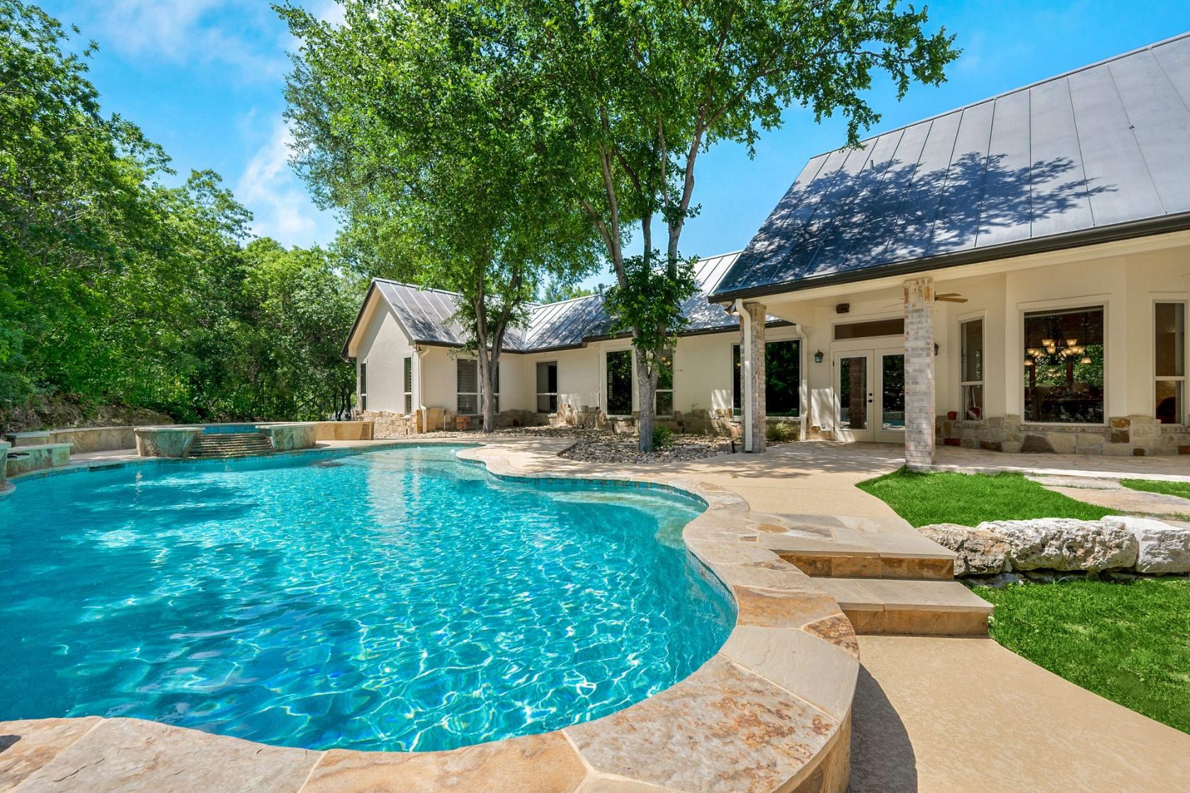 Resort-like backyard pool under the trees