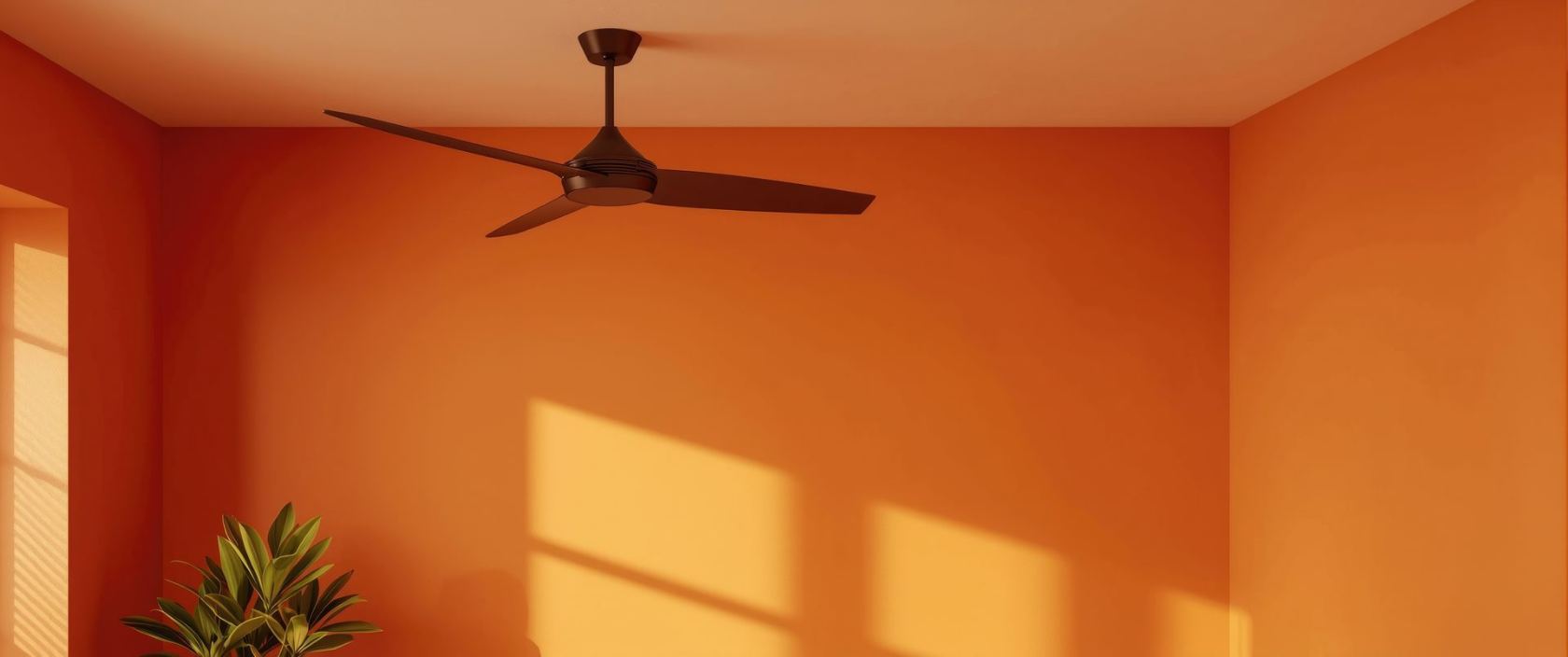 A freshly painted warm terracotta room with a ceiling fan